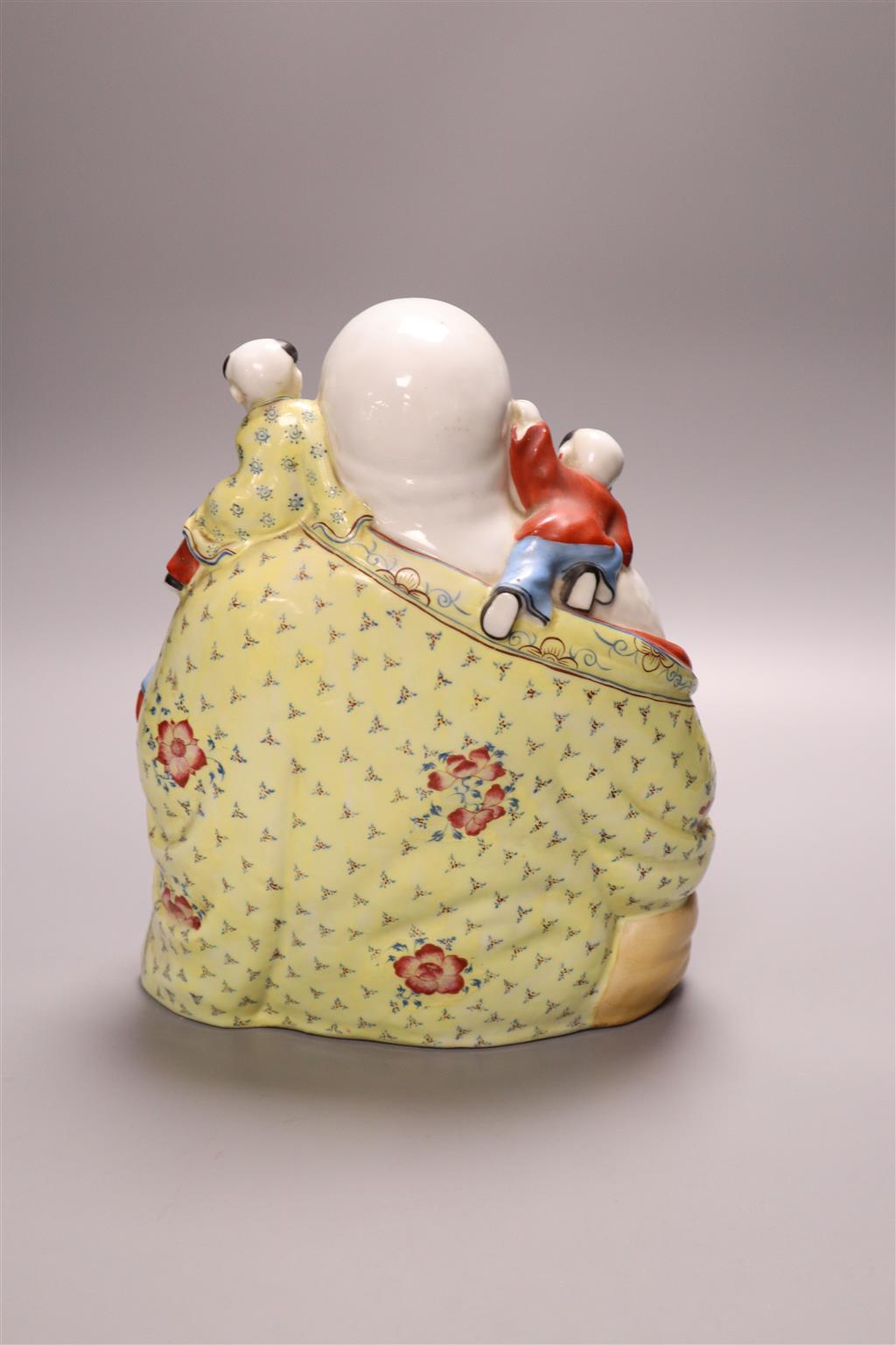 A Chinese famille rose figure of Budai, mid 20th century, 26cm